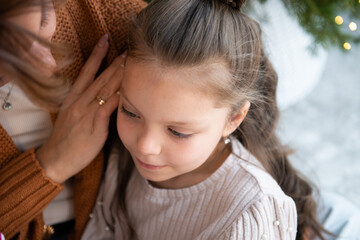 Tender moment between mother and daughter during Christmas