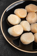 Raw sea scallop seafood fresh tasty food dish delicious gourmet food background on the table rustic food top view copy space keto and paleo diet vegetarian  food pescetarian diet