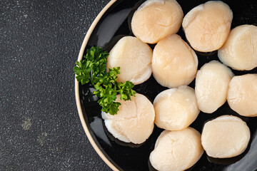 Raw sea scallop seafood fresh tasty food dish delicious gourmet food background on the table rustic food top view copy space keto and paleo diet vegetarian  food pescetarian diet