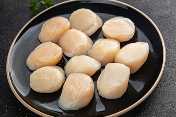 Raw sea scallop seafood fresh tasty food dish delicious gourmet food background on the table rustic food top view copy space keto and paleo diet vegetarian  food pescetarian diet
