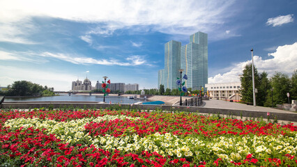 Flowerbed with red and yellow flowers on embankment timelapse hyperlapse. Astana, Kazakhstan