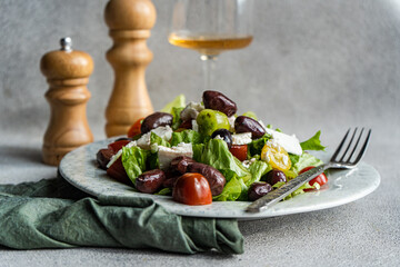 Fresh Greek Salad with Feta Cheese and Olives with Wine