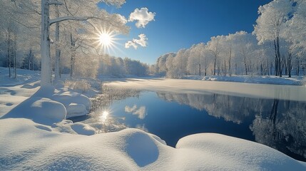 Snowy landscape with frozen pond and bare trees in winter