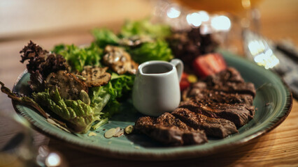 A gourmet plate featuring tender grilled steak, fresh salad, and mushrooms, celebrating the art of fine dining and culinary simplicity.