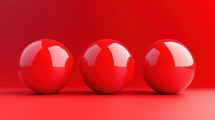 Three glossy red spheres aligned on a vibrant red background. Minimalism and balance concept.