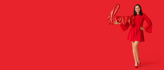 Beautiful young woman with air balloon in shape of word LOVE on red background. Valentine's Day celebration