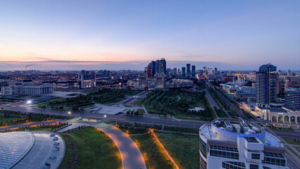 Aerial view over the city center and central business district night to day timelapse, Kazakhstan, Astana