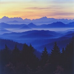 a layered mountain range at sunset