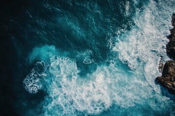 Vibrant Ocean Waves Crashing on Rocky Coastline