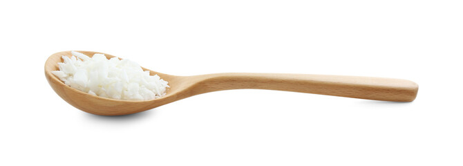 Soy wax in wooden spoon isolated on white