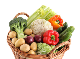 Different ripe vegetables in basket isolated on white