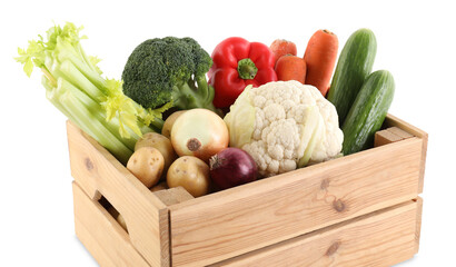 Different ripe vegetables in wooden crate isolated on white