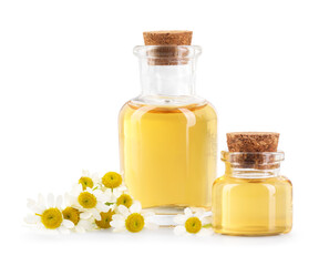 Bottles of essential oil and chamomile flowers isolated on white
