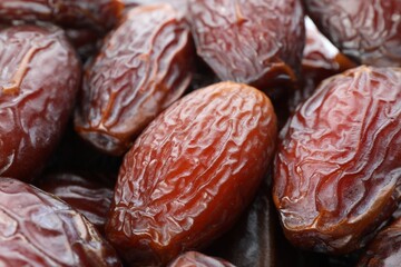 Many tasty dried dates as background, closeup