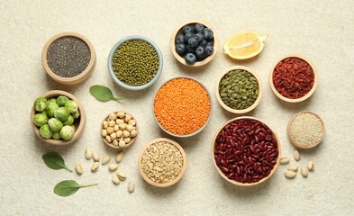 Different superfood products on light table, flat lay