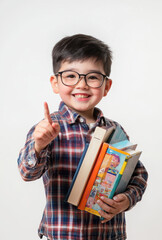 Young boy happily holding books and pointing, excited to share his knowledge