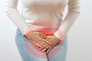 Women's health concept. Lower Abdominal Pain in Females. Woman suffering from spasms and pain...