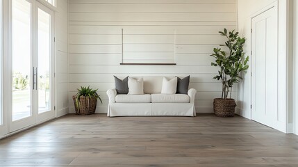 Bright and airy living room with a cozy sofa and plants.