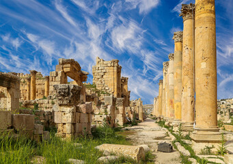 Roman ruins (against the background of a beautiful sky with clouds) in the Jordanian city of Jerash (Gerasa of Antiquity), capital and largest city of Jerash Governorate, Jordan