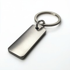 A metal keychain with a sleek, minimalistic design and engraved details on a white background