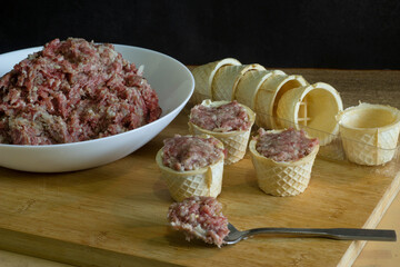 raw minced meat on wooden board