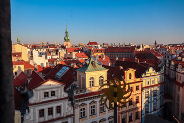 Rooftop view of Prague's Old Town. Red-tiled roofs of historic buildings create vibrant and...