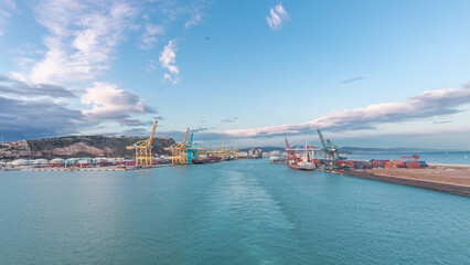 Aerial view of sea with waves and port from ship sailing in the open sea timelapse