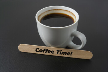 A cup of coffee with a word Coffee Time on black background