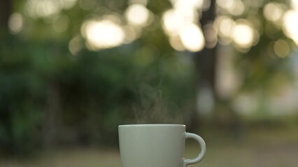 Morning Coffee Ritual in Outdoor Garden with Hot Drink Savoring Americano Espresso and Hot Tea in Nature's Embrace