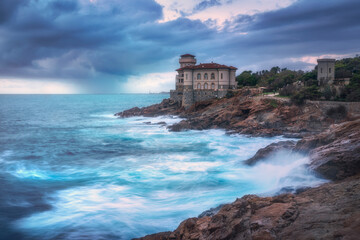 Boccale castle on the rocks and rough sea. Livorno, Tuscany region, Italy
