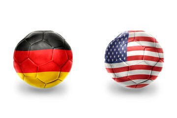 Naklejka premium football balls with national flags of germany and united states of america ,soccer teams. on the white background.