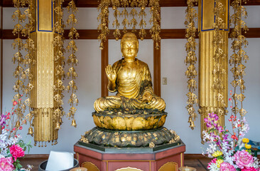 Golden statue of Buddha at Fushimi Inari Taisha, in Kyoto Japan.