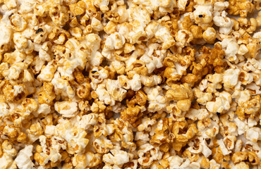 Caramel Popcorn Texture - Close-Up of Sweet and Crunchy Snack. High-resolution Close-up Shot of Caramel-coated Popcorn.