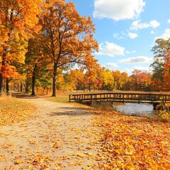 Obraz premium A scenic autumn pathway lined with colorful foliage and a wooden bridge.