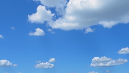 Clear blue sky with fluffy clouds
