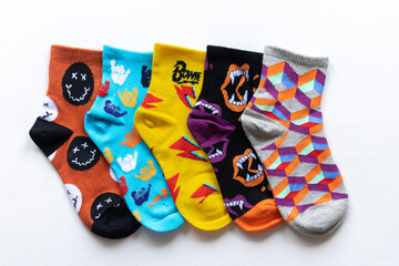 children's colorful socks close-up on a white background. print on socks sports