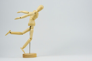Articulated wooden figure representing the position of some type of physical exercise