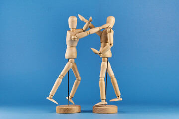 Wooden figures representing positions and movements in a martial arts training
