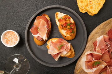 Tasty bruschetta served with wine on gray background. High quality photo