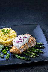 Green asparagus with grilled chicken fillet and couscous