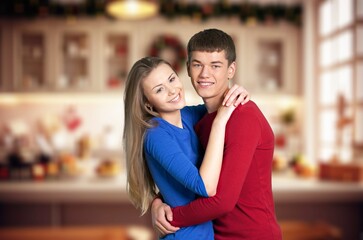 Portrait of beautiful happy couple hug at home