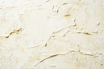 Fototapeta premium Close-up of cream textured plaster wall surface with abstract patterns
