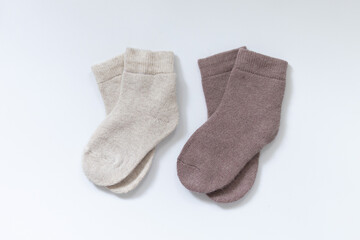 two Pair of striped woolen knitted socks isolated on white