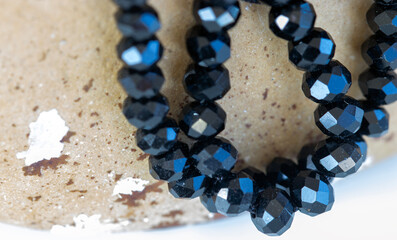 Natural stone background colored bead jewelry detail.