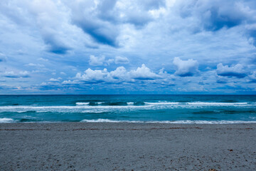 Mediterranean sea on stormy weather in Sardinia, Italy. Sardinian beach with cloudy sky.