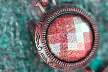 A circle in a shimmering natural stone, close -up jewelry