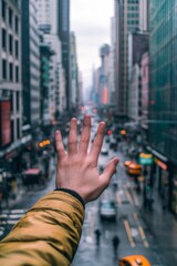 Fototapeta premium Open hand, city street, blurred background.