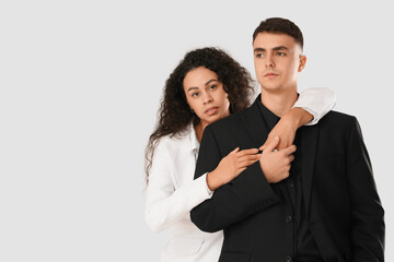 Young couple hugging on white background. Yin Yang concept