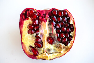 White background isolated pomegranate  pomegranate seeds. 