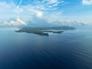 The scenic island of Bangka, just north of Sulawesi in Indonesia, is fringed by healthy coral reefs and mangroves. This area is part of the Coral Triangle and harbors astounding marine biodiversity.